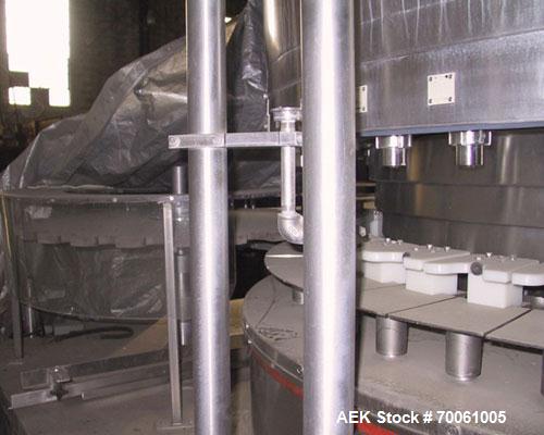 Used Used: Serac Filler Model R36 rotary filler.  Handles containers up to 5-1/2" diam on every spout, minimum height containers: 4". Currently set up with nozzles that have a 2" OD collar, 1-1/2" di...