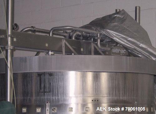 Used Used: Serac Filler Model R36 rotary filler.  Handles containers up to 5-1/2" diam on every spout, minimum height containers: 4". Currently set up with nozzles that have a 2" OD collar, 1-1/2" di...