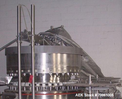 Used Used: Serac Filler Model R36 rotary filler.  Handles containers up to 5-1/2" diam on every spout, minimum height containers: 4". Currently set up with nozzles that have a 2" OD collar, 1-1/2" di...
