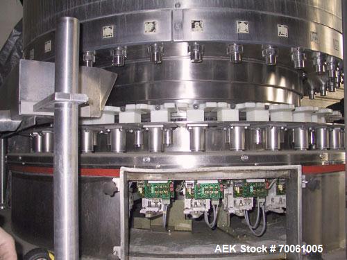 Used Used: Serac Filler Model R36 rotary filler.  Handles containers up to 5-1/2" diam on every spout, minimum height containers: 4". Currently set up with nozzles that have a 2" OD collar, 1-1/2" di...