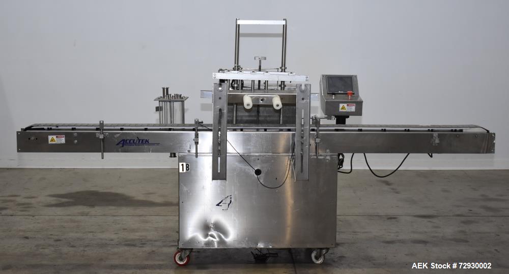 Used- Accutek AccuVac Series 4-Head Automatic Vacuum Filler. 4-Diving nozzles. Production speed up to 60 CPM. Approximate fi...