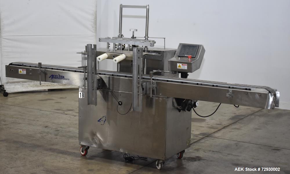 Used- Accutek AccuVac Series 4-Head Automatic Vacuum Filler. 4-Diving nozzles. Production speed up to 60 CPM. Approximate fi...