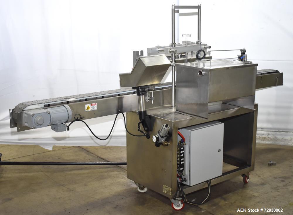 Used- Accutek AccuVac Series 4-Head Automatic Vacuum Filler. 4-Diving nozzles. Production speed up to 60 CPM. Approximate fi...