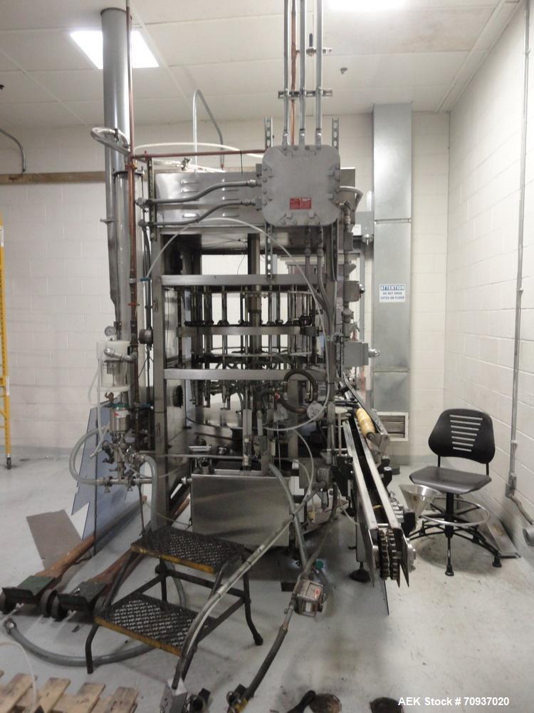 Used JG Machine 18 Head Rotary Vacuum Pocket Filler. Production rates up to 80 cpm(depending on size and material filled). Has stainless steel supply tank, explosion proof, vacuum jar, stainless stee...