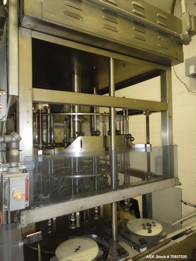 Used JG Machine 18 Head Rotary Vacuum Pocket Filler. Production rates up to 80 cpm(depending on size and material filled). Has stainless steel supply tank, explosion proof, vacuum jar, stainless stee...