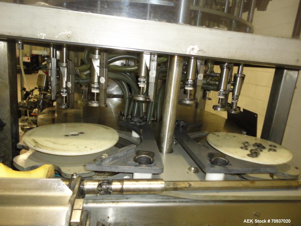 Used JG Machine 18 Head Rotary Vacuum Pocket Filler. Production rates up to 80 cpm(depending on size and material filled). Has stainless steel supply tank, explosion proof, vacuum jar, stainless stee...