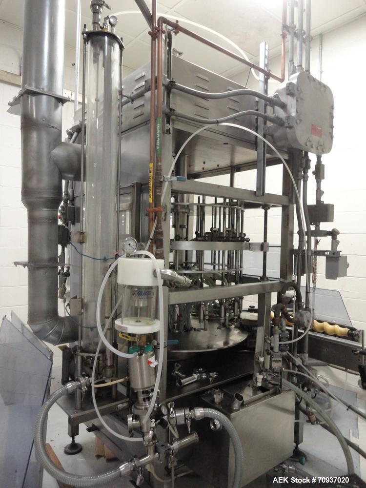 Used JG Machine 18 Head Rotary Vacuum Pocket Filler. Production rates up to 80 cpm(depending on size and material filled). Has stainless steel supply tank, explosion proof, vacuum jar, stainless stee...