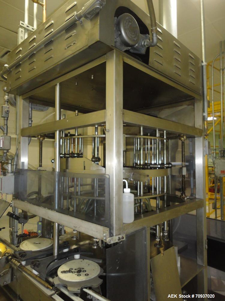 Used JG Machine 18 Head Rotary Vacuum Pocket Filler. Production rates up to 80 cpm(depending on size and material filled). Has stainless steel supply tank, explosion proof, vacuum jar, stainless stee...