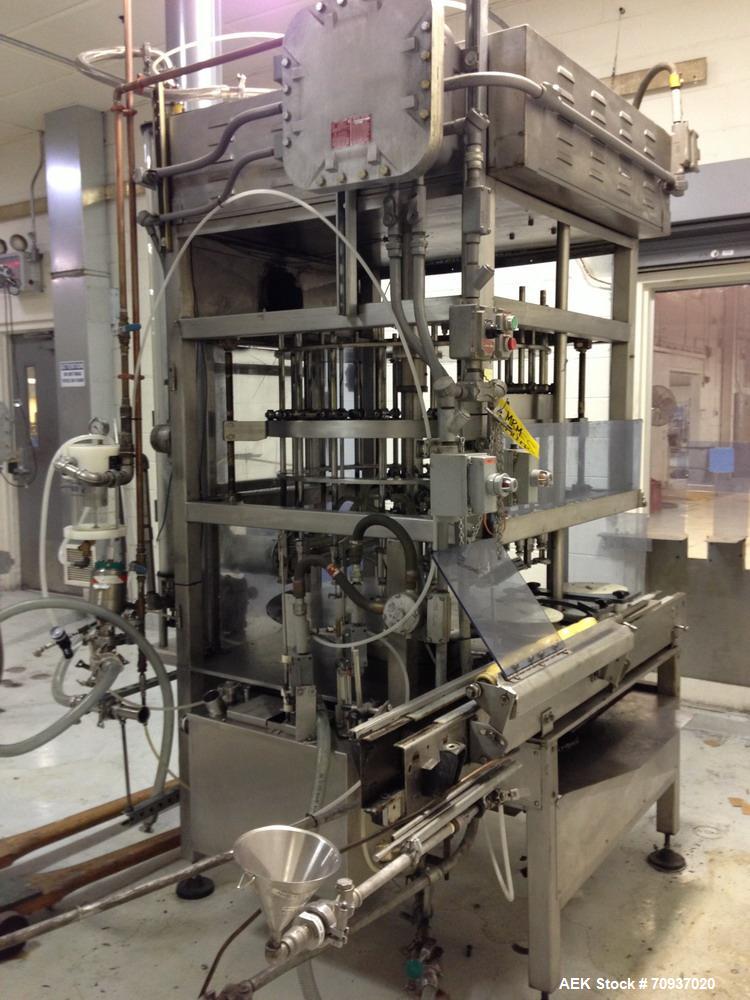Used JG Machine 18 Head Rotary Vacuum Pocket Filler. Production rates up to 80 cpm(depending on size and material filled). Has stainless steel supply tank, explosion proof, vacuum jar, stainless stee...