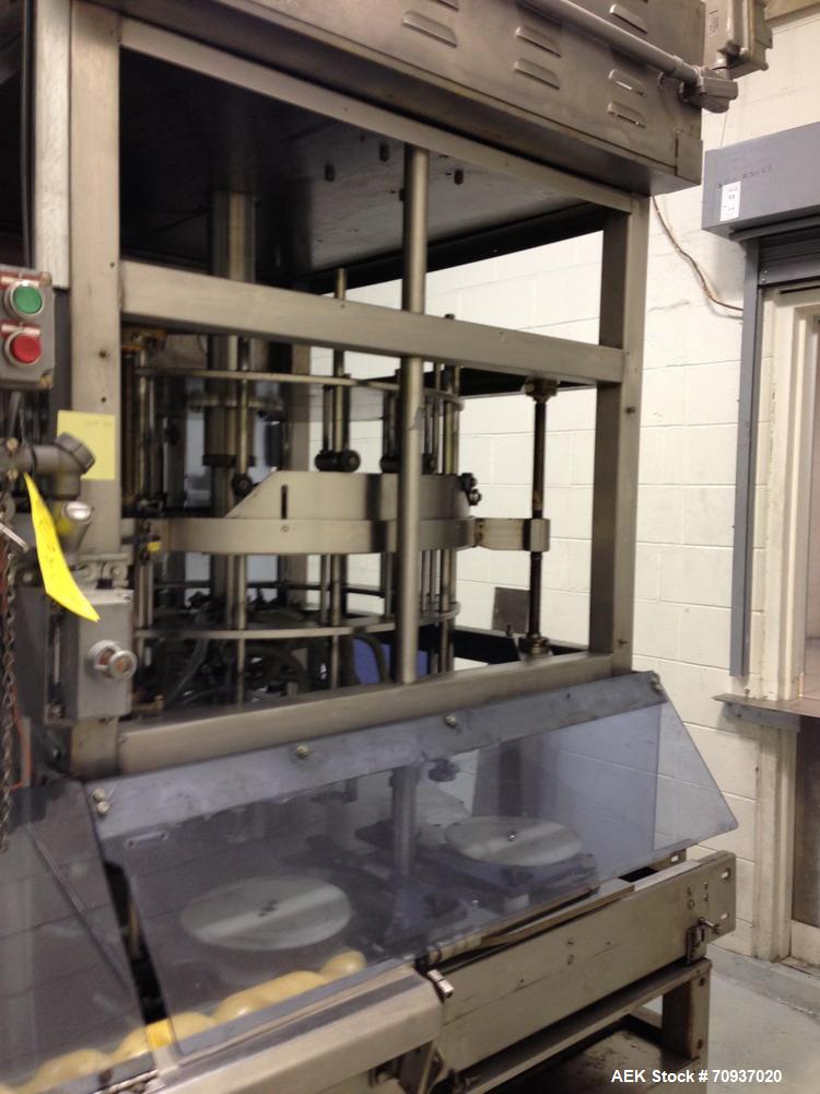 Used JG Machine 18 Head Rotary Vacuum Pocket Filler. Production rates up to 80 cpm(depending on size and material filled). Has stainless steel supply tank, explosion proof, vacuum jar, stainless stee...