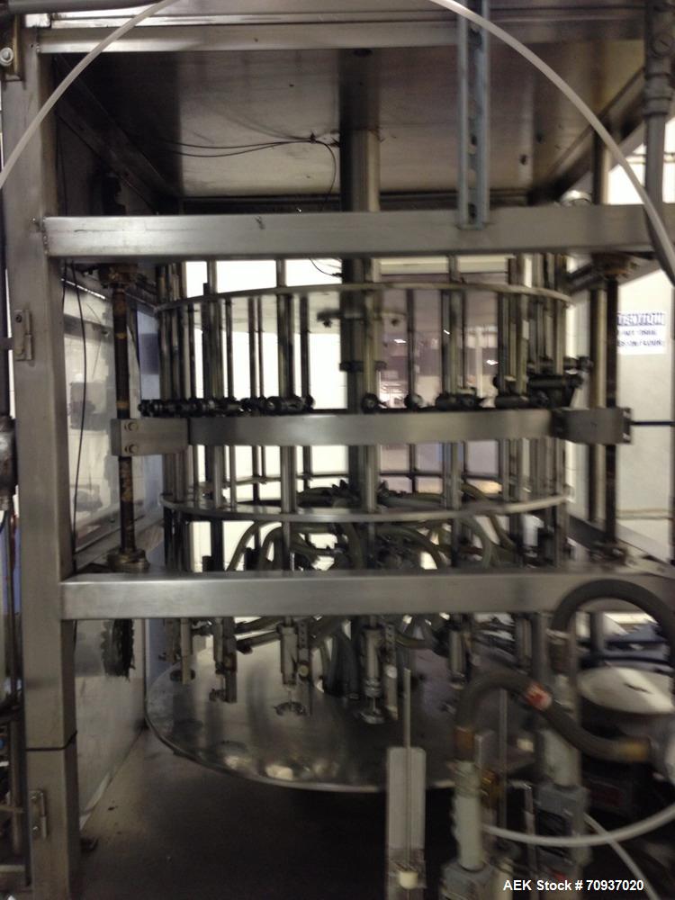 Used JG Machine 18 Head Rotary Vacuum Pocket Filler. Production rates up to 80 cpm(depending on size and material filled). Has stainless steel supply tank, explosion proof, vacuum jar, stainless stee...