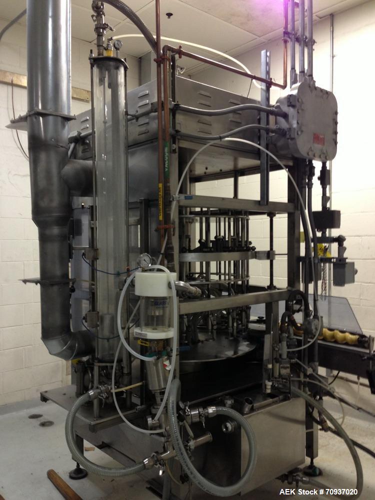 Used JG Machine 18 Head Rotary Vacuum Pocket Filler. Production rates up to 80 cpm(depending on size and material filled). Has stainless steel supply tank, explosion proof, vacuum jar, stainless stee...