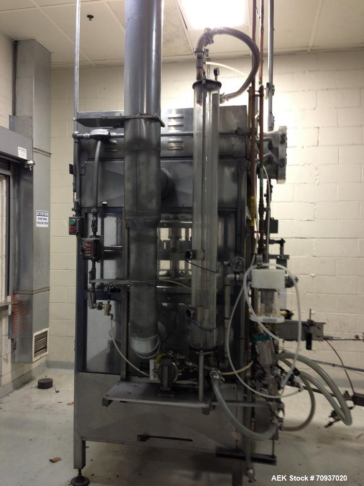 Used JG Machine 18 Head Rotary Vacuum Pocket Filler. Production rates up to 80 cpm(depending on size and material filled). Has stainless steel supply tank, explosion proof, vacuum jar, stainless stee...
