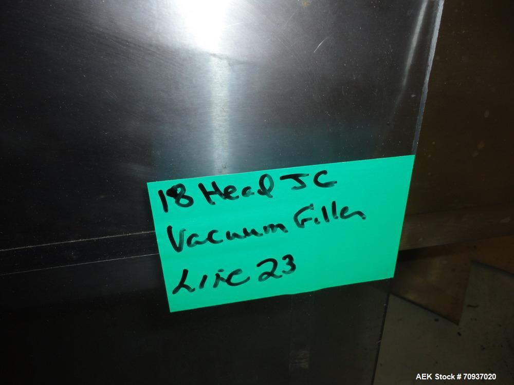 Used JG Machine 18 Head Rotary Vacuum Pocket Filler. Production rates up to 80 cpm(depending on size and material filled). Has stainless steel supply tank, explosion proof, vacuum jar, stainless stee...