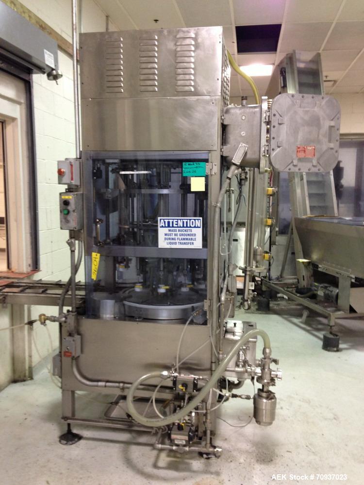 Used JG Machine 12 Head Rotary Vacuum Pocket Filler. Production rates up to 80 cpm(depending on size and material filled). Has stainless steel supply tank, explosion proof, vacuum jar, stainless stee...