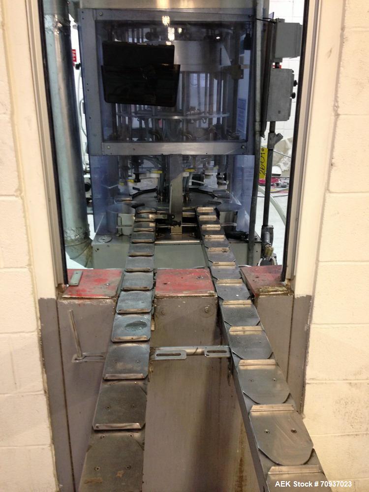 Used JG Machine 12 Head Rotary Vacuum Pocket Filler. Production rates up to 80 cpm(depending on size and material filled). Has stainless steel supply tank, explosion proof, vacuum jar, stainless stee...
