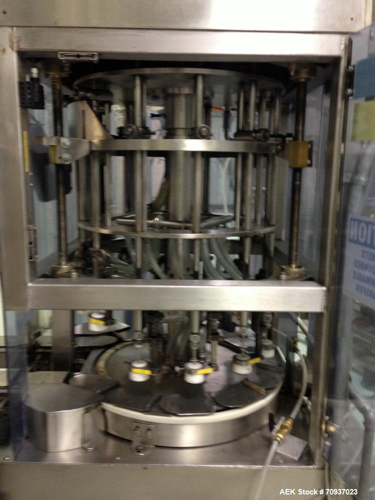 Used JG Machine 12 Head Rotary Vacuum Pocket Filler. Production rates up to 80 cpm(depending on size and material filled). Has stainless steel supply tank, explosion proof, vacuum jar, stainless stee...