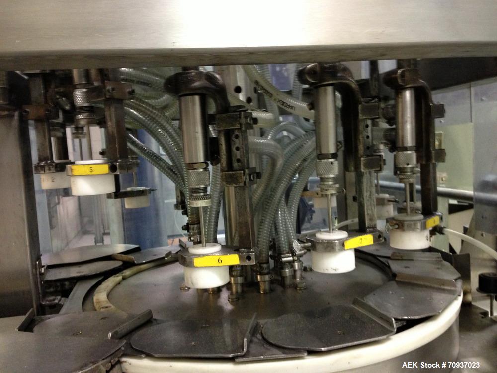 Used JG Machine 12 Head Rotary Vacuum Pocket Filler. Production rates up to 80 cpm(depending on size and material filled). Has stainless steel supply tank, explosion proof, vacuum jar, stainless stee...