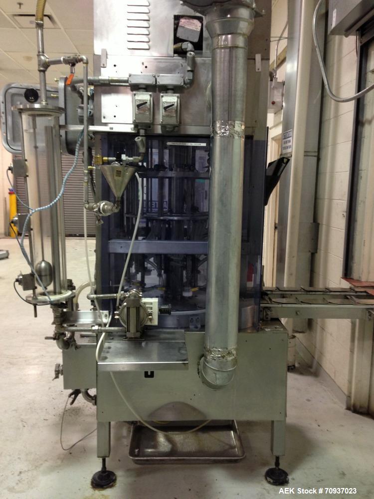 Used JG Machine 12 Head Rotary Vacuum Pocket Filler. Production rates up to 80 cpm(depending on size and material filled). Has stainless steel supply tank, explosion proof, vacuum jar, stainless stee...