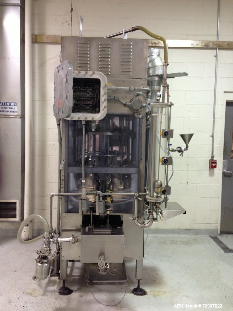 Used JG Machine 12 Head Rotary Vacuum Pocket Filler. Production rates up to 80 cpm(depending on size and material filled). Has stainless steel supply tank, explosion proof, vacuum jar, stainless stee...