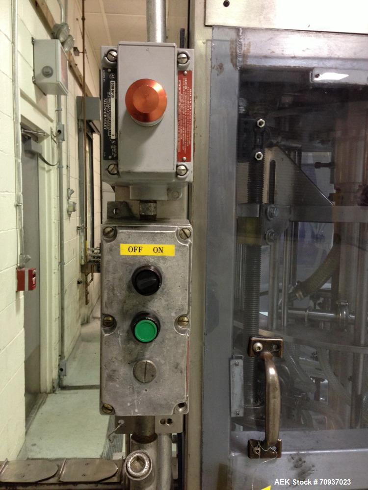 Used JG Machine 12 Head Rotary Vacuum Pocket Filler. Production rates up to 80 cpm(depending on size and material filled). Has stainless steel supply tank, explosion proof, vacuum jar, stainless stee...