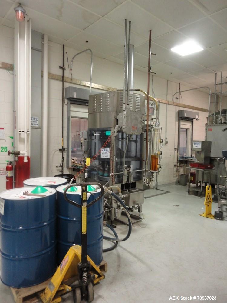 Used JG Machine 12 Head Rotary Vacuum Pocket Filler. Production rates up to 80 cpm(depending on size and material filled). Has stainless steel supply tank, explosion proof, vacuum jar, stainless stee...