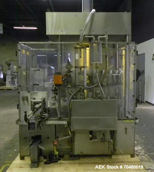 Used MRM Elgin 24 Head Rotary Gravity Overflow Filler. Capable of speeds up to 130 containers per minute. Machine is set on 6" centers with centering belts and 3/16" diameter nozzles. Screw conveyor ...