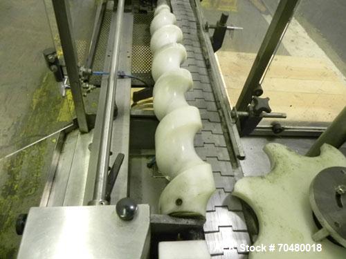 Used MRM Elgin 24 Head Rotary Gravity Overflow Filler. Capable of speeds up to 130 containers per minute. Machine is set on 6" centers with centering belts and 3/16" diameter nozzles. Screw conveyor ...