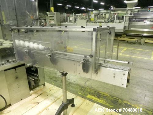 Used MRM Elgin 24 Head Rotary Gravity Overflow Filler. Capable of speeds up to 130 containers per minute. Machine is set on 6" centers with centering belts and 3/16" diameter nozzles. Screw conveyor ...