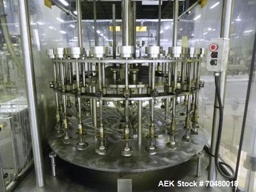 Used MRM Elgin 24 Head Rotary Gravity Overflow Filler. Capable of speeds up to 130 containers per minute. Machine is set on 6" centers with centering belts and 3/16" diameter nozzles. Screw conveyor ...