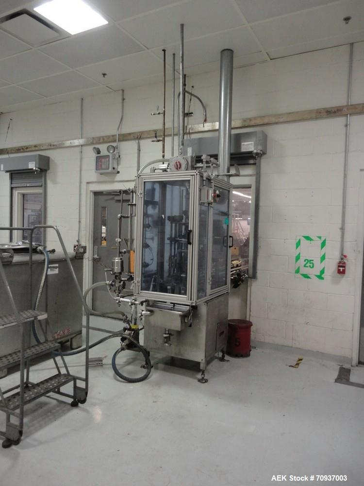 Used MRM 8 Head Rotary Vacuum Filler, speeds up to 100 bottles per minute maximum, vacuum jar, explosion proof design, stainless steel and Lexan guards.

