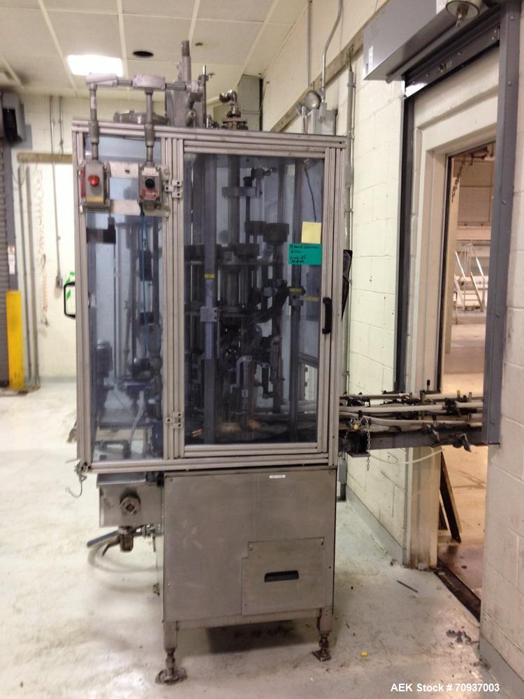 Used MRM 8 Head Rotary Vacuum Filler, speeds up to 100 bottles per minute maximum, vacuum jar, explosion proof design, stainless steel and Lexan guards.

