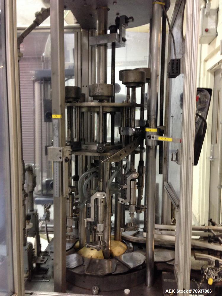 Used MRM 8 Head Rotary Vacuum Filler, speeds up to 100 bottles per minute maximum, vacuum jar, explosion proof design, stainless steel and Lexan guards.

