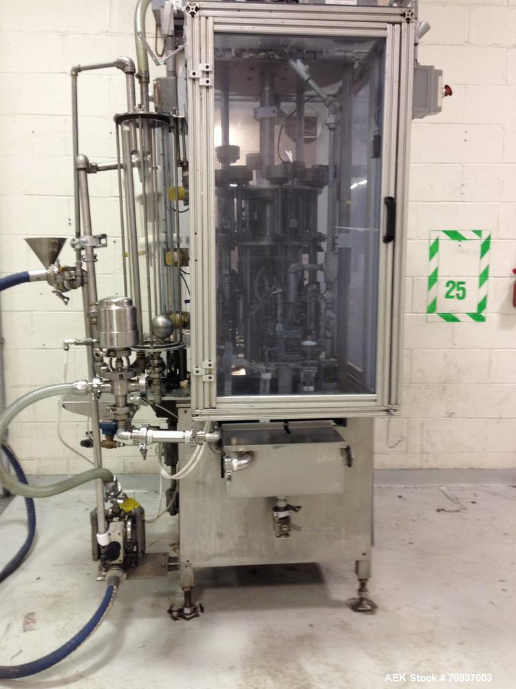 Used MRM 8 Head Rotary Vacuum Filler, speeds up to 100 bottles per minute maximum, vacuum jar, explosion proof design, stainless steel and Lexan guards.

