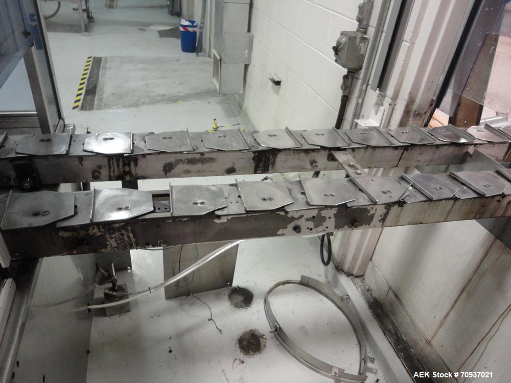 Used RJM 12 Head Rotary Vacuum Filler, explosion proof, vacuum jar, stainless steel and lexan guards, stainless steel supply tank. Pocket filler design (no container handling parts).