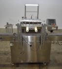 Used- Accutek AccuVac Series 4-Head Automatic Vacuum Filler. 4-Diving nozzles. Production speed up to 60 CPM. Approximate fi...