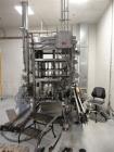 Used JG Machine 18 Head Rotary Vacuum Pocket Filler. Production rates up to 80 cpm(depending on size and material filled). Has stainless steel supply tank, explosion proof, vacuum jar, stainless stee...