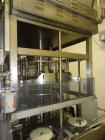 Used JG Machine 18 Head Rotary Vacuum Pocket Filler. Production rates up to 80 cpm(depending on size and material filled). Has stainless steel supply tank, explosion proof, vacuum jar, stainless stee...