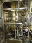 Used JG Machine 18 Head Rotary Vacuum Pocket Filler. Production rates up to 80 cpm(depending on size and material filled). Has stainless steel supply tank, explosion proof, vacuum jar, stainless stee...