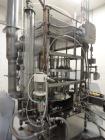 Used JG Machine 18 Head Rotary Vacuum Pocket Filler. Production rates up to 80 cpm(depending on size and material filled). Has stainless steel supply tank, explosion proof, vacuum jar, stainless stee...