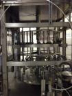 Used JG Machine 18 Head Rotary Vacuum Pocket Filler. Production rates up to 80 cpm(depending on size and material filled). Has stainless steel supply tank, explosion proof, vacuum jar, stainless stee...