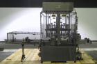 Used MRM Elgin 24 Head Rotary Gravity Overflow Filler. Capable of speeds up to 130 containers per minute. Machine is set on 6