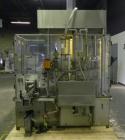 Used MRM Elgin 24 Head Rotary Gravity Overflow Filler. Capable of speeds up to 130 containers per minute. Machine is set on 6