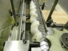 Used MRM Elgin 24 Head Rotary Gravity Overflow Filler. Capable of speeds up to 130 containers per minute. Machine is set on 6