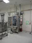 Used MRM 8 Head Rotary Vacuum Filler, speeds up to 100 bottles per minute maximum, vacuum jar, explosion proof design, stainless steel and Lexan guards.

