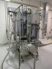 Used RJM 12 Head Rotary Vacuum Filler, explosion proof, vacuum jar, stainless steel and lexan guards, stainless steel supply tank. Pocket filler design (no container handling parts).
