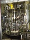 Used RJM 12 Head Rotary Vacuum Filler, explosion proof, vacuum jar, stainless steel and lexan guards, stainless steel supply tank. Pocket filler design (no container handling parts).