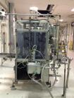Used RJM 12 Head Rotary Vacuum Filler, explosion proof, vacuum jar, stainless steel and lexan guards, stainless steel supply tank. Pocket filler design (no container handling parts).