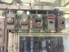 Used RJM 12 Head Rotary Vacuum Filler, explosion proof, vacuum jar, stainless steel and lexan guards, stainless steel supply tank. Pocket filler design (no container handling parts).