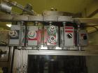 Used RJM 12 Head Rotary Vacuum Filler, explosion proof, vacuum jar, stainless steel and lexan guards, stainless steel supply tank. Pocket filler design (no container handling parts).